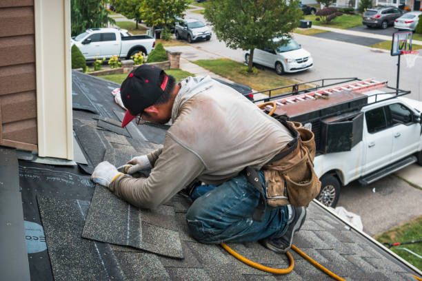 Professional Roofing technician working in Winburne, PA